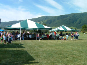 Green and white party tents set up for a special occasion