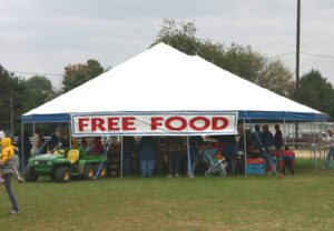 White party tent set up for food vendors