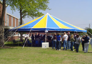 Circle yellow and blue event tent set up
