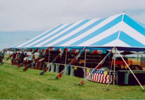 Blue and white event tent set up for an event