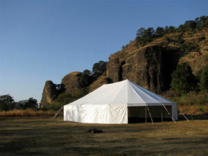 All white party tent set up for an outdoor event