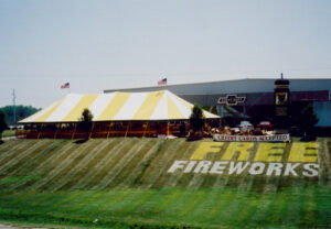 Large firework tent set up in a parking lot