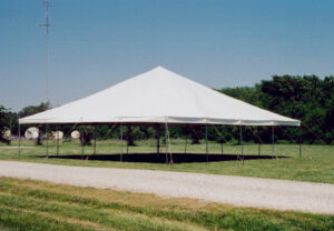 All white event tent set up in a field