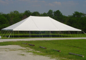All white pole tent set up at Miami Missionary Tent Co