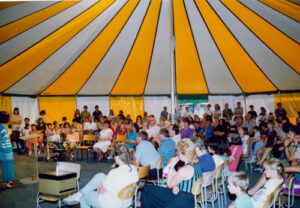 White and yellow round pole tent from underneath