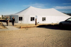 All white pole tent with windows put in it