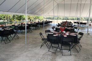 Large white event tent set up for a special event