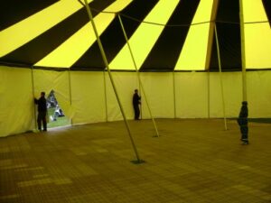 Under a commercial party tent while being set up