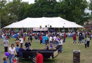 A large event tent filled with people at Family Fest