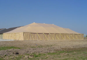 Large all sand pole tent set up in a field