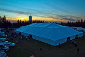Miami Missionary Tent Company - large white tent under a beautiful sunset
