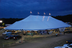 Large all white party tent set up for an event