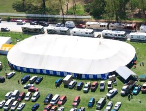 Large all white commercial tent set up for an event